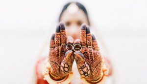 A bride showing wedding rings 